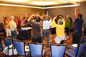 SG presenters involved attendees in an activity "Rock Paper Scissors".